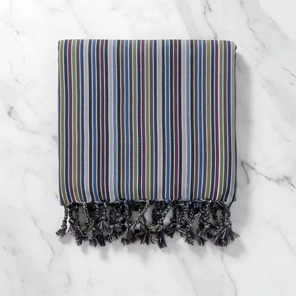 Handwoven earthy striped turkish hand towel with muted blue green purple and gray stripes and dark gray tassels