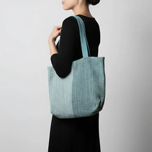 A light blue handwoven ethiopian cotton tote bag with matching shoulder straps perfect for everyday use