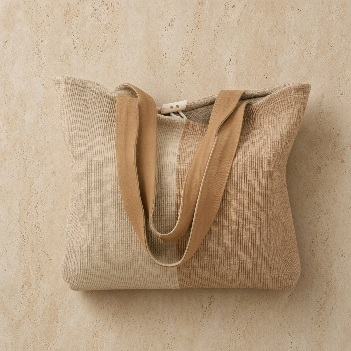 Beige handwoven ethiopian cotton tote bag with tan fabric straps and button closure perfect for everyday use