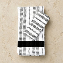 Handwoven hache weave towel from guatemala’s western highlands with black and white stripes and solid black band