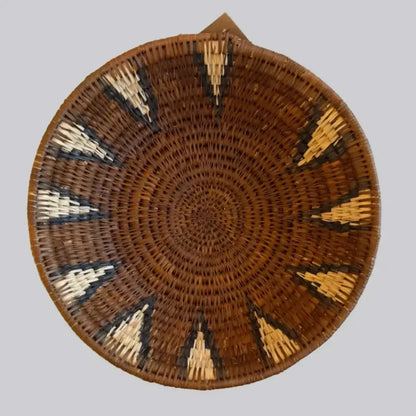Handwoven large african zulu bowl with a radial brown cream and black pattern made from sustainably sourced ilala palm in south africa