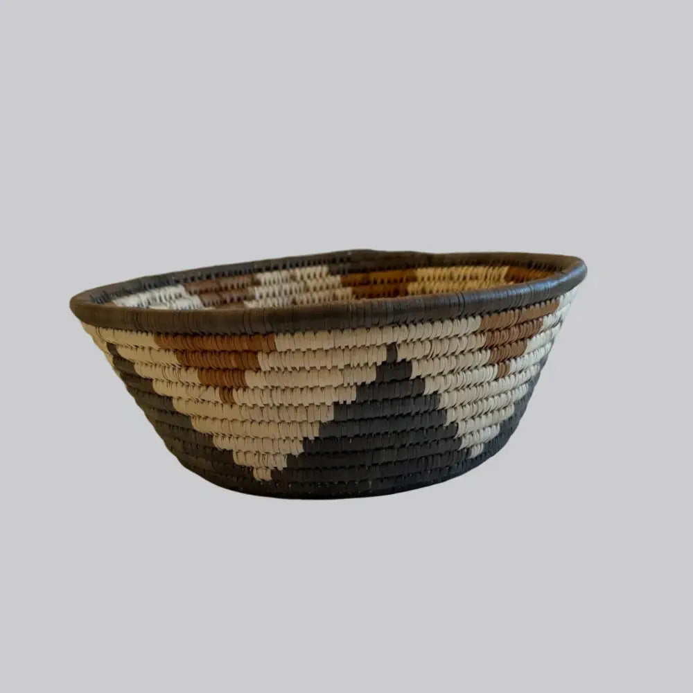 Handwoven large african zulu bowl star in natural beige brown and dark gray made from sustainably sourced ilala palm south africa
