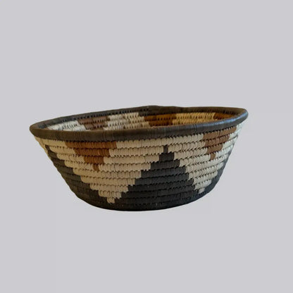 Handwoven large african zulu bowl star in natural beige brown and dark gray made from sustainably sourced ilala palm south africa