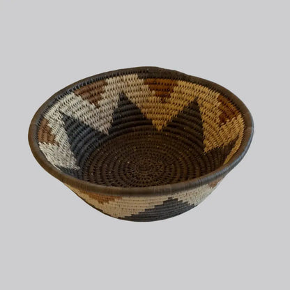 Handwoven large african zulu bowl with geometric pattern in earthy browns made from sustainably sourced ilala palm south africa