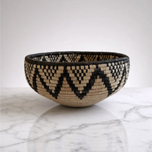 Handwoven large african zulu bowl in black and beige with geometric triangles made from sustainably sourced ilala palm from south africa