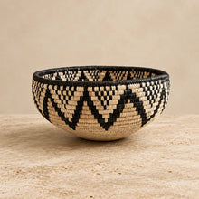 Handwoven large african zulu bowl with black and beige geometric triangles made from sustainably sourced ilala palm in south africa