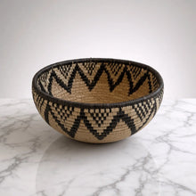 Handwoven large african zulu bowl with black and beige zigzag pattern made from sustainably sourced ilala palm south africa