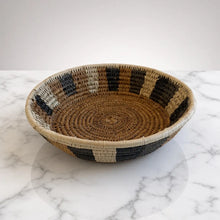 Handwoven medium african zulu bowl with geometric black beige and natural tones made from sustainably sourced ilala palm from south africa