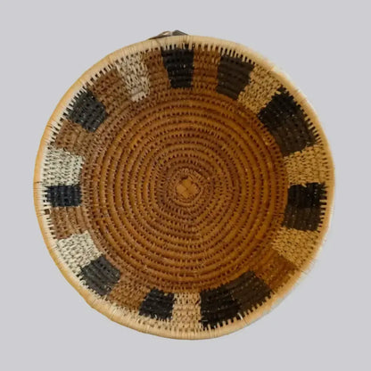 Handwoven medium african zulu bowl with tan base and black beige geometric patterns made from sustainably sourced ilala palm in south africa