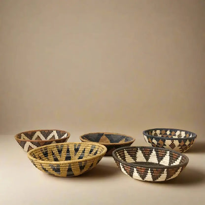 Handwoven medium african zulu bowl in natural black and beige ilala palm with geometric pattern sustainably sourced from south africa