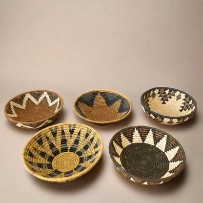 Handwoven medium african zulu bowl in earthy tones with geometric patterns made from sustainably sourced ilala palm from south africa