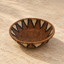 Handwoven medium african zulu bowl made from ilala palm and wild grasses with natural brown cream and black geometric patterns