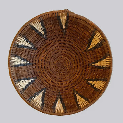 Handwoven medium african zulu bowl with geometric patterns in natural brown cream and dark accents made from sustainably sourced ilala palm south africa