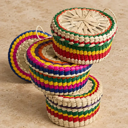 Colorful handwoven mexican palm tortilla basket with rainbow stripes and natural handles perfect for taco night warm tortillas