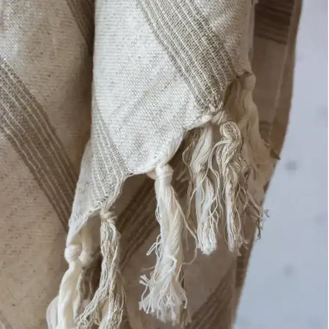 Beige and cream striped turkish towel with fringed edges in light brown stripes linen-cotton blend fabric