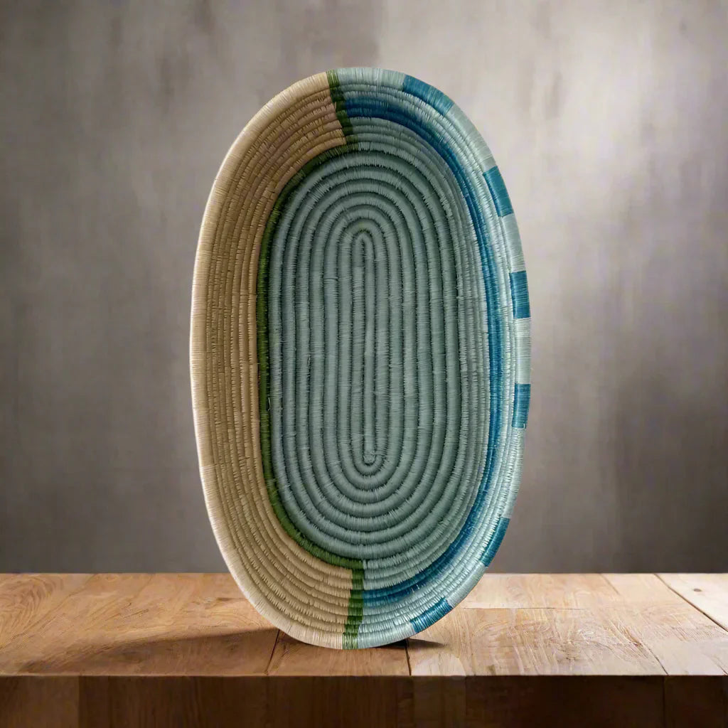 Handwoven sisal bread basket with blue stripes for serving and organizing essentials