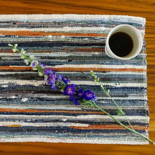 Upcycled Fabric Placemat with cup of coffee and a wildflower