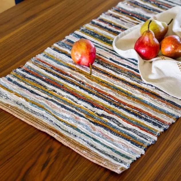 Colorful striped handwoven upcycled fabric table runner with fringed edges