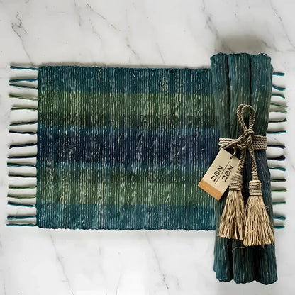 Handwoven vetiver placemats set of 6 in teal green stripes with fringed edges tied with natural twine and tassels