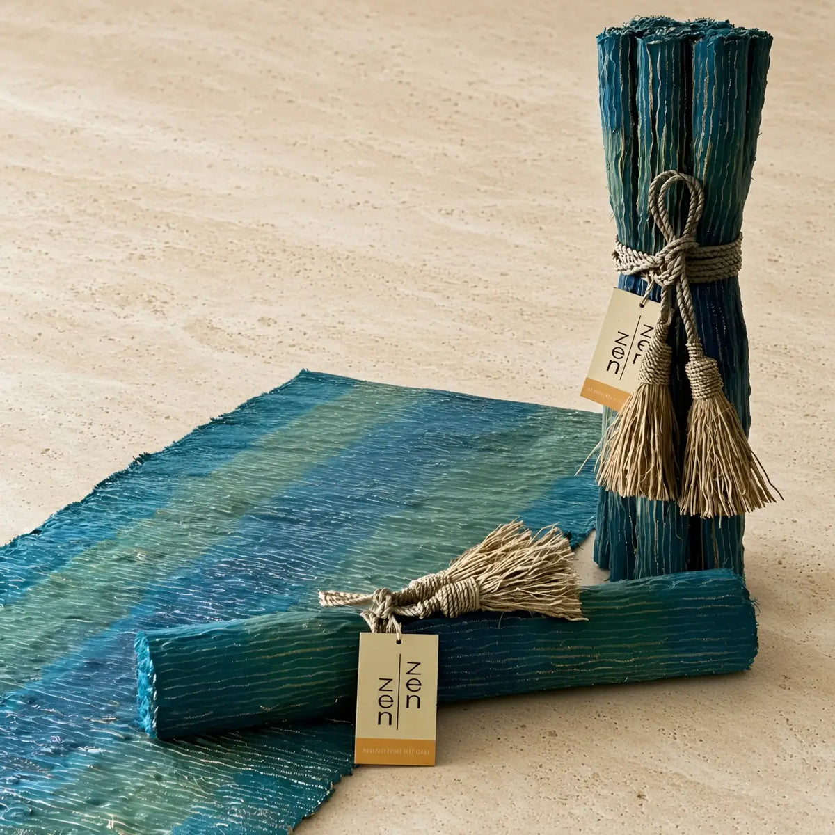 Teal and green striped handwoven vetiver table runner with deep blue accents in a textured natural fiber finish