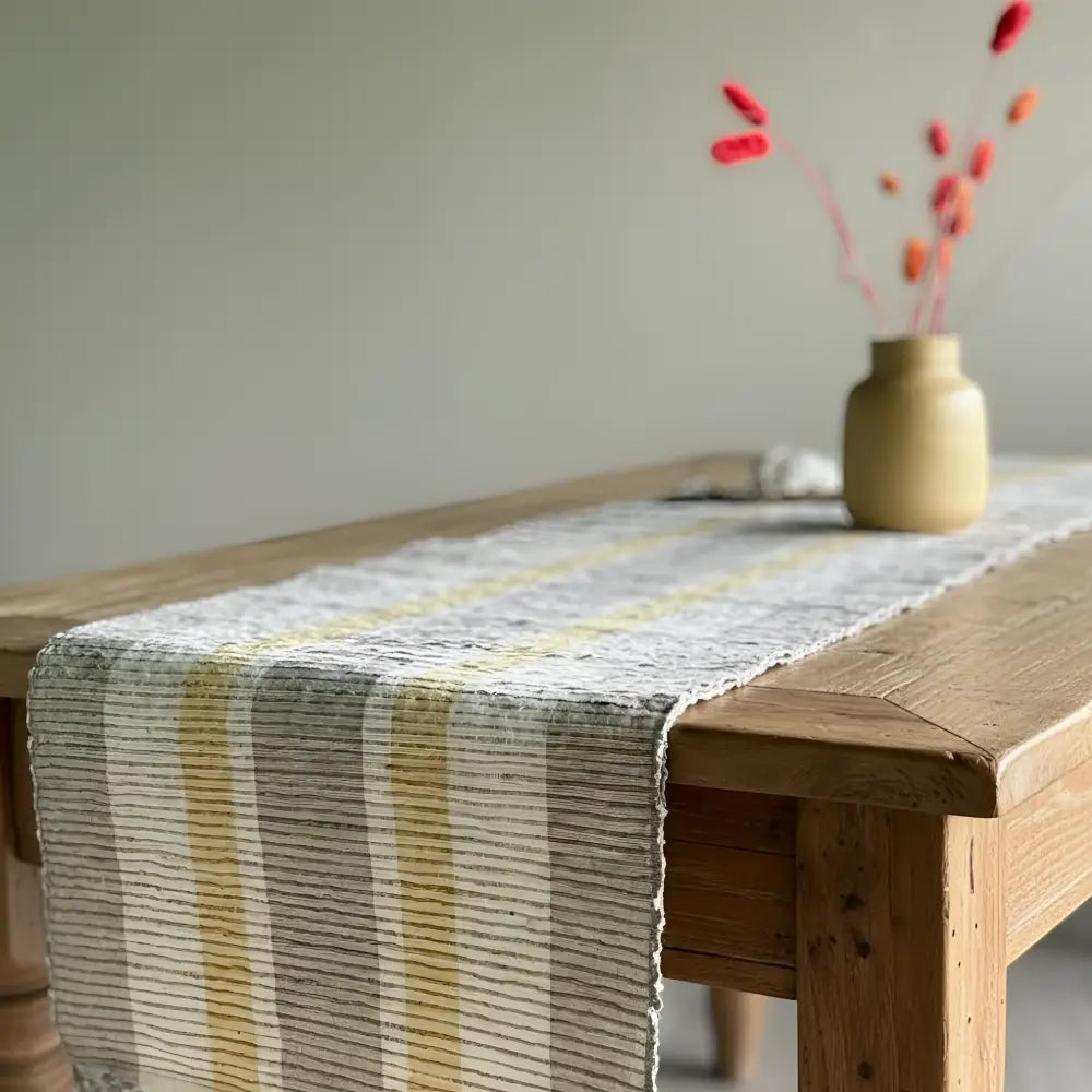 Handwoven vetiver table runner with textured woven vertical stripes in muted yellow and gray perfect for any table runner