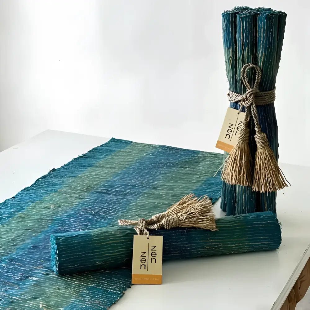 Handwoven vetiver table runner in deep blue and green with teal striped natural fiber texture for elegant table decor