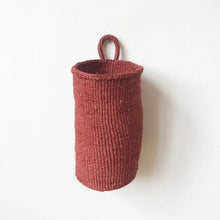 Woven oblong hanging basket made from sisal with one hanging loop.