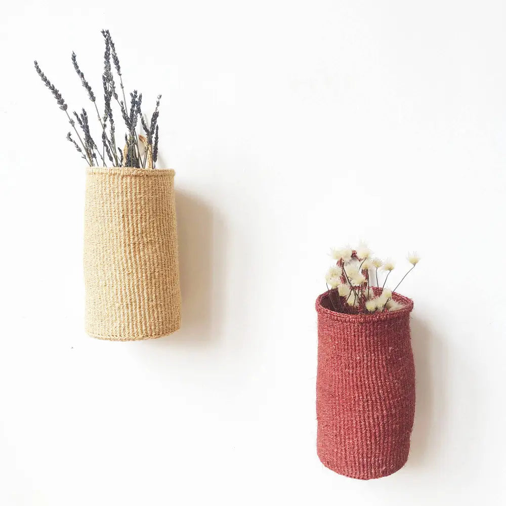 Woven oblong hanging basket made from sisal with one hanging loop.