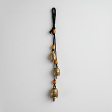 Handmade harmony bells with brass trio, orange beads on black rope