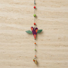 Purple wooden heart-shaped authentic nana bell wind chime with green wings orange floral patterns and brass bell on black cord