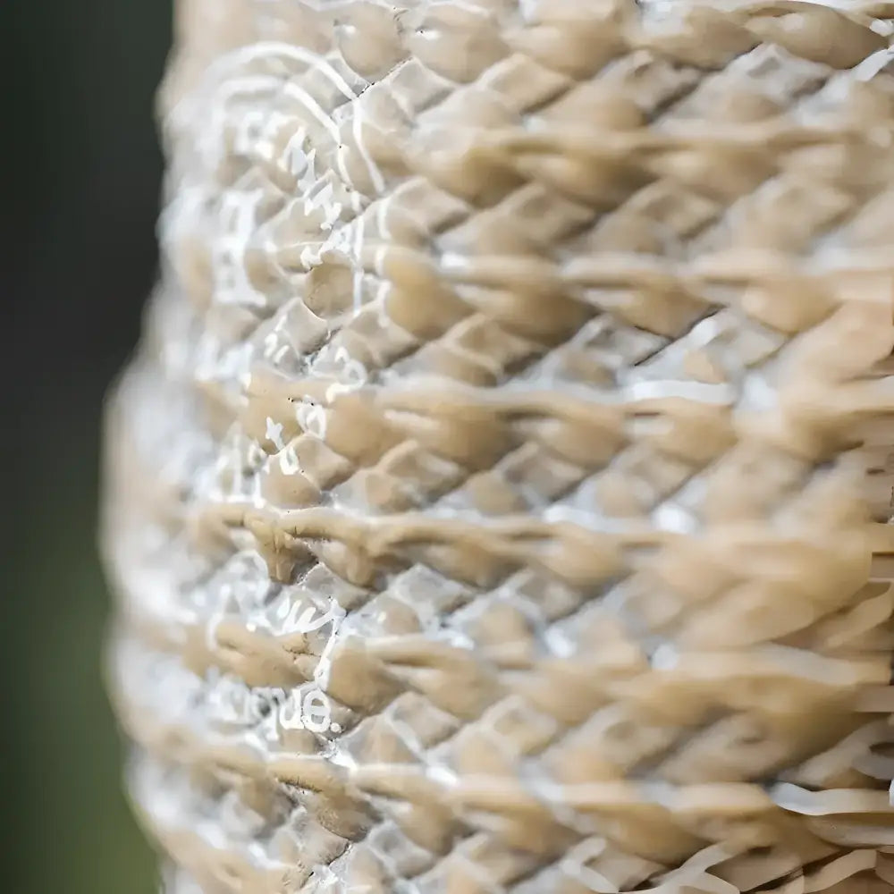 A vase shaped small planter with a woven bag shape and design