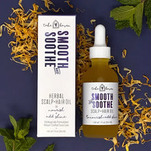 Take haven herbal hair oil smooth and soothe in clear glass bottle with white dropper cap containing golden essential oils