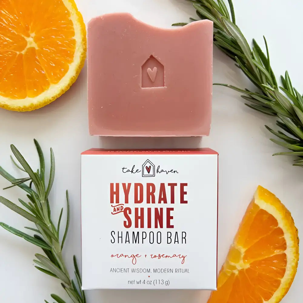 A pink herbal shampoo bar with nourishing organic oils shaped like a house with a heart provides dandruff relief