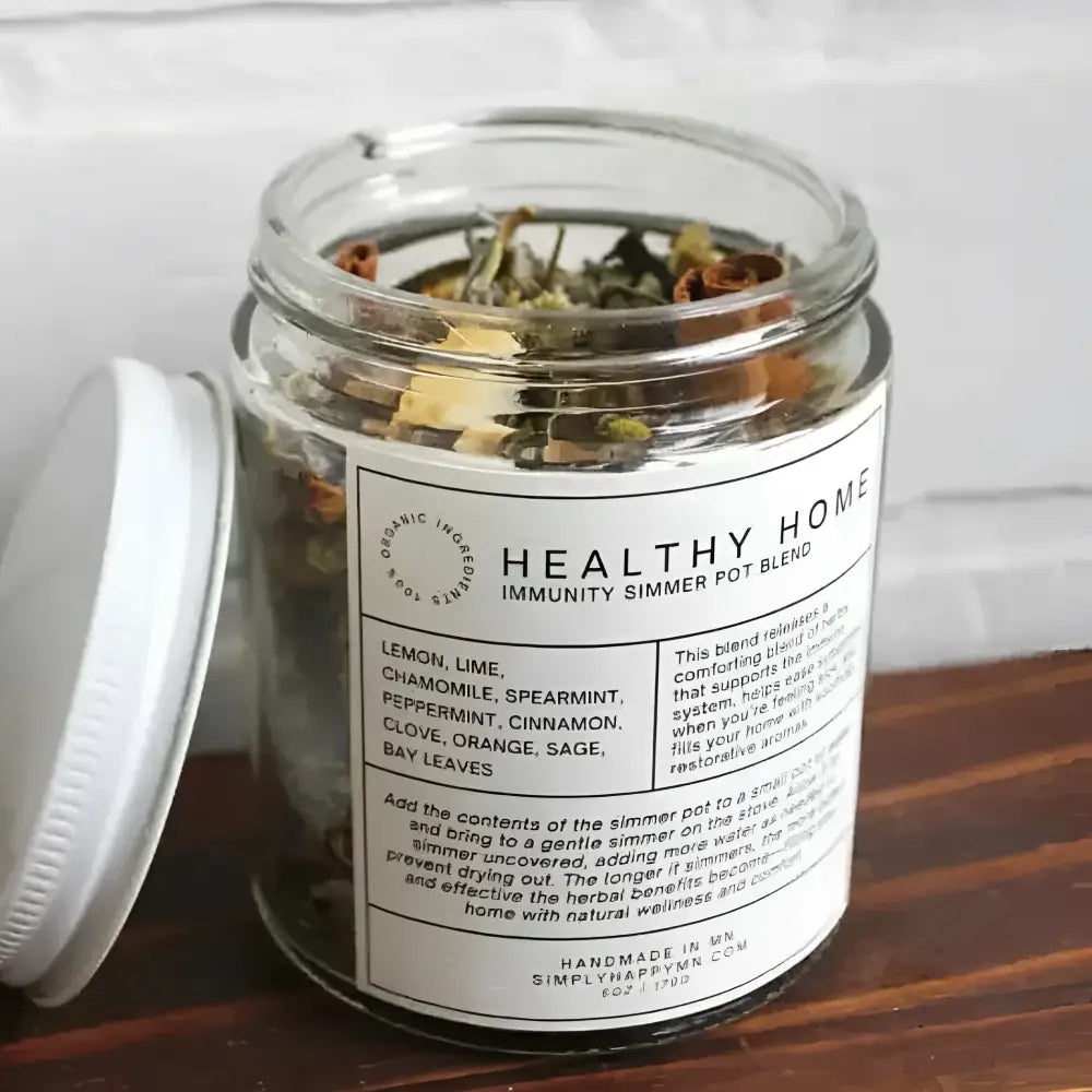 Clear glass jar with colorful dried herbs and spices labeled healthy home immunity simmer pot blend by simplyhappymn