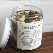 Clear glass jar with colorful dried herbs and spices labeled healthy home immunity simmer pot blend by simplyhappymn
