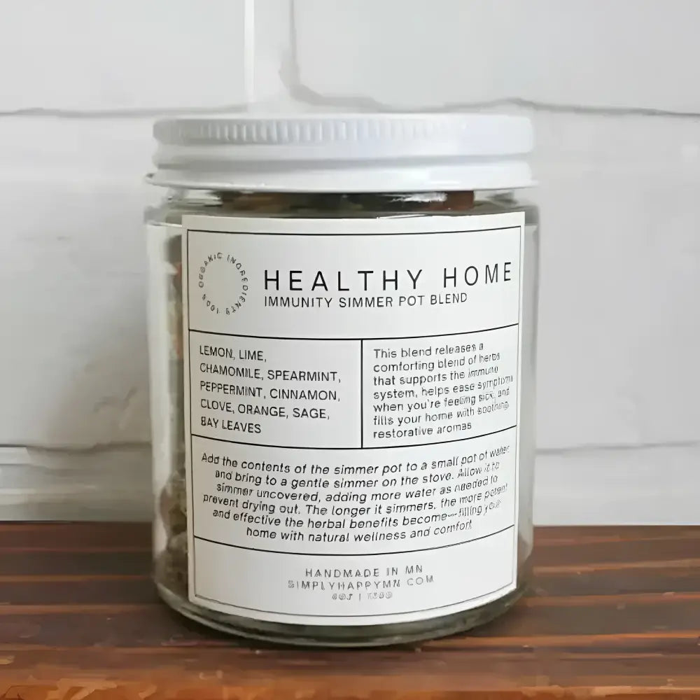 Clear glass jar with white lid containing simplyhappy healthy home immunity simmer pot blend dried herbs for simmer pot use