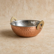 Hand hammered handi double wall copper serving bowl with polished steel interior and ornate brass handles serving dish