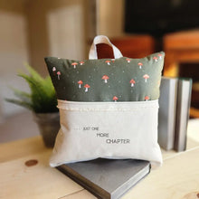 Handmade reading pillow in olive green mushroom print with Just One More Chapter text