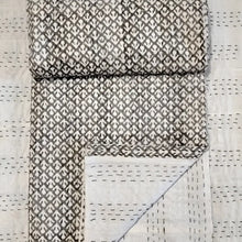 Traditional Indian Kantha quilt with block print in tan.