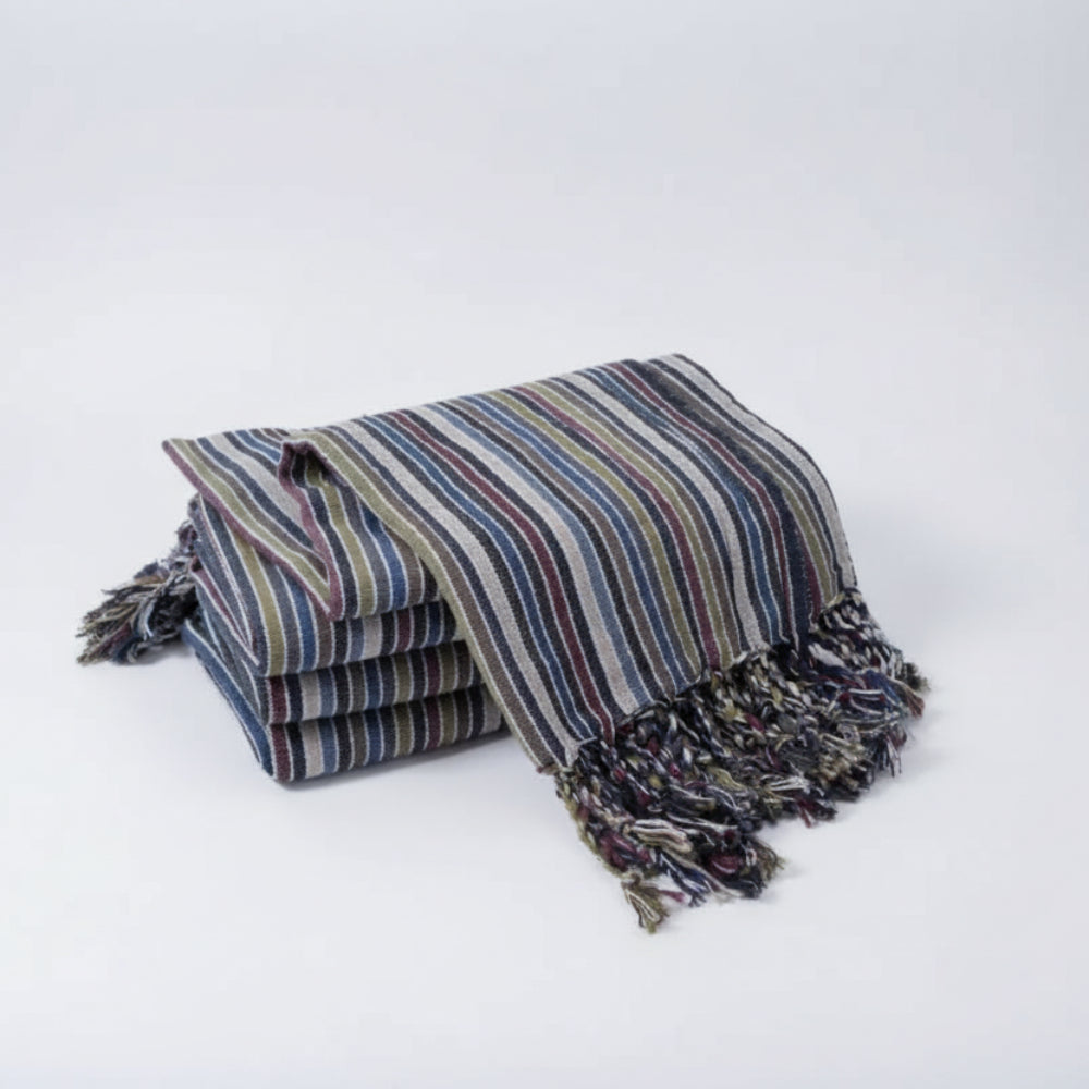Striped Kekova Towel throw blanket in dark blue and multicolored stripes