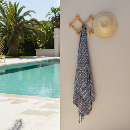 Wooden wall hook with woven straw hat and striped Kekova Towel