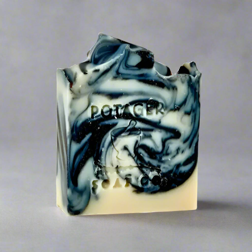 Lavender Charcoal Soap bar with marbled black, white, and cream colors for a charcoal cleansing ritual