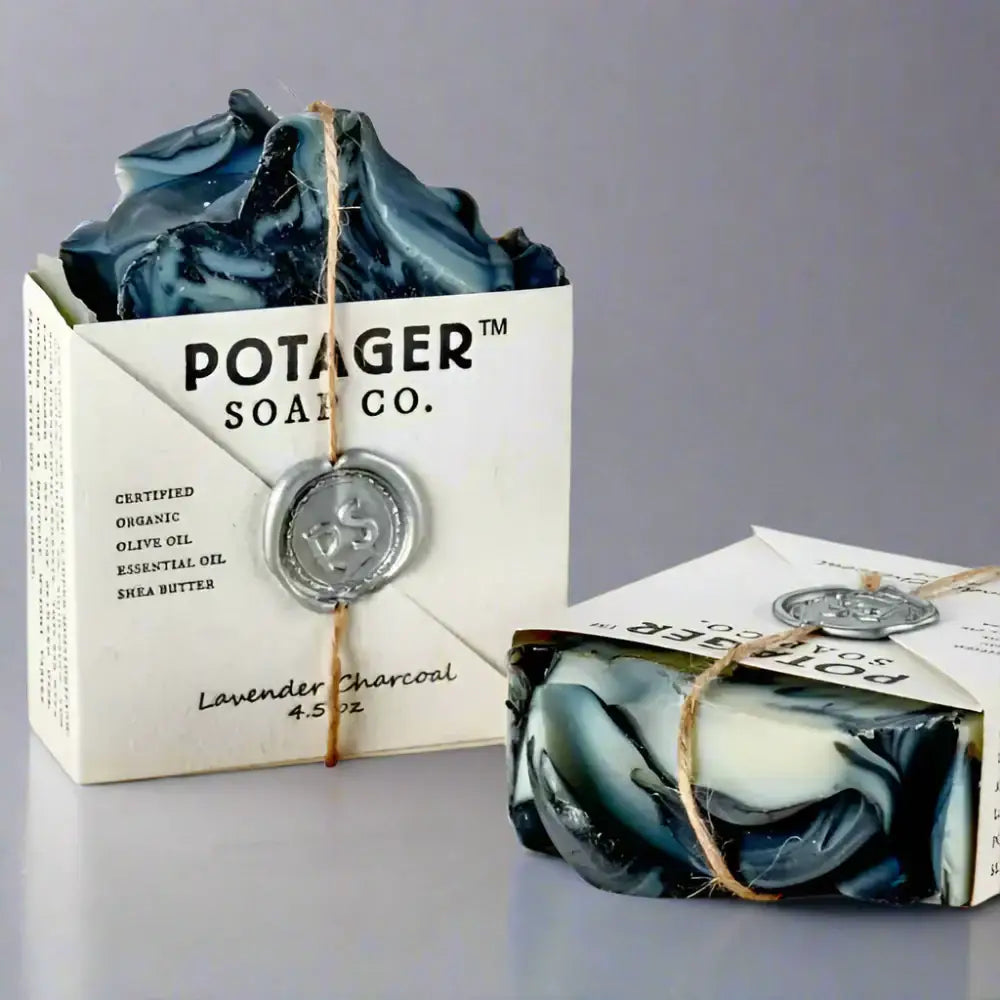 Two bars of Potager’s Lavender Charcoal soap for the charcoal cleansing ritual