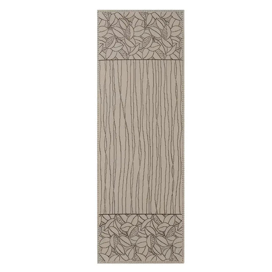 Beige table runner with black woven design of lines and leaves.