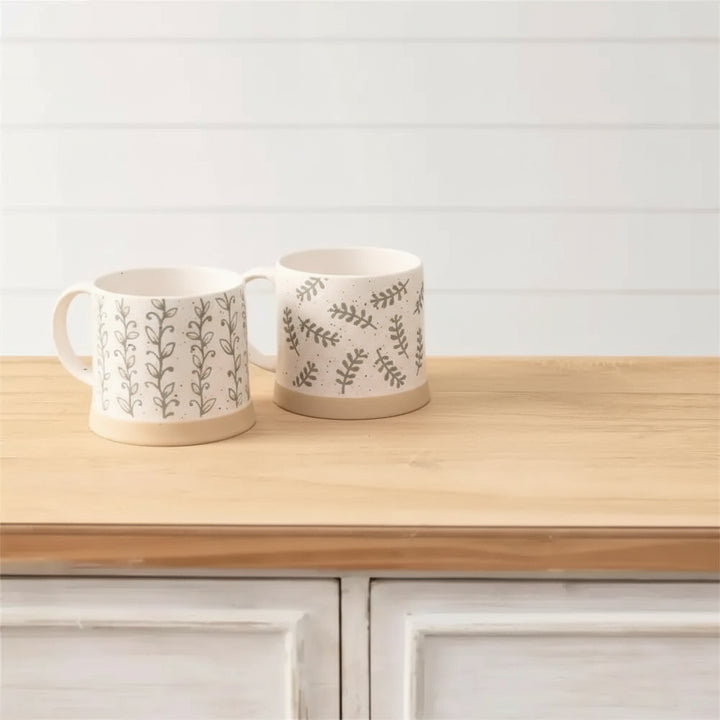 Set of three leafy green stoneware mugs with nature-inspired patterns perfect for your kitchen