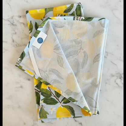 Linen tea towel with bright yellow lemon and green leaf pattern handmade from pure cotton for kitchen decor