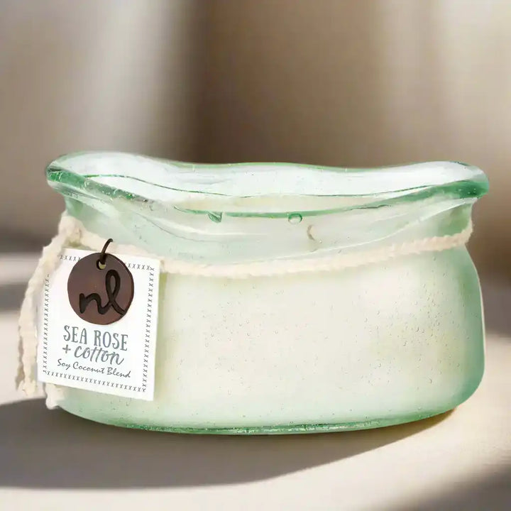 Light green bubble glass candle jar with Sea Rose and Cotton scent from our candle collection