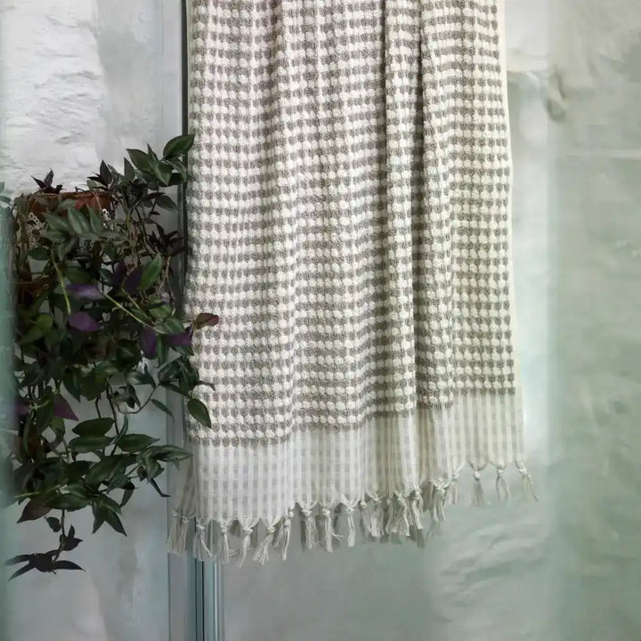 Hand loomed thick 100% Turkish cotton Dotted Terry Hand Towel in neutral taupe colorway.