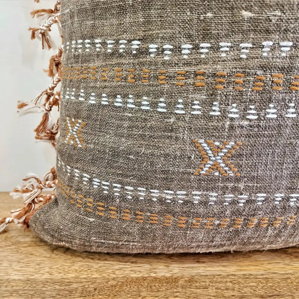 Throw pillow cover size 20 inch x 20 inch with rough linen texture, tassels, and hand embroidered accents.