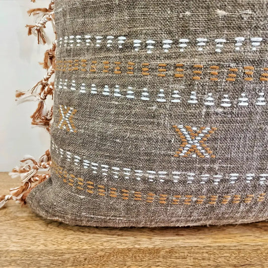Throw pillow cover size 20 inch x 20 inch with rough linen texture, tassels, and hand embroidered accents.